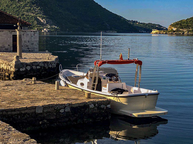 a boat docked on Our Lady of the Rocks