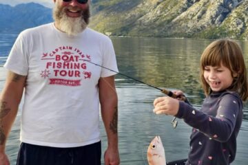 first big catch - HERO image of ivan and his daughter holding her first big fish