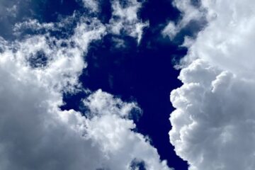 White clouds in contrast to the deep blue - hero image