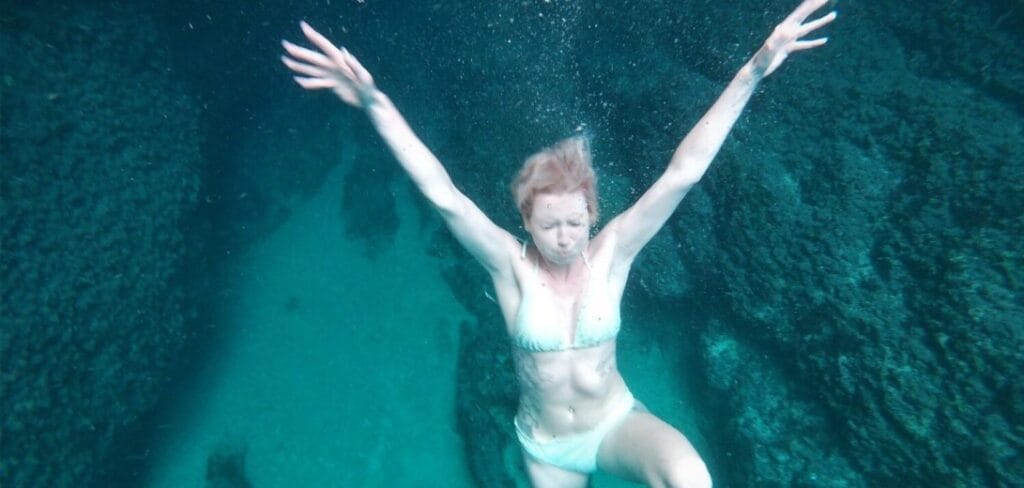 Blue Cave Tour - A picture of a girl on a deep dive
